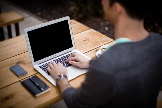 digital-nomad-working-outside-with-laptop