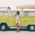 young woman in front of green vw van