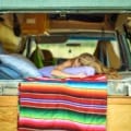 woman sleeping in a campervan