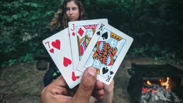 play-card-game-outside-campfire