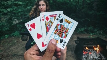 play-card-game-outside-campfire