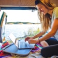 woman-in-van-working-on-laptop