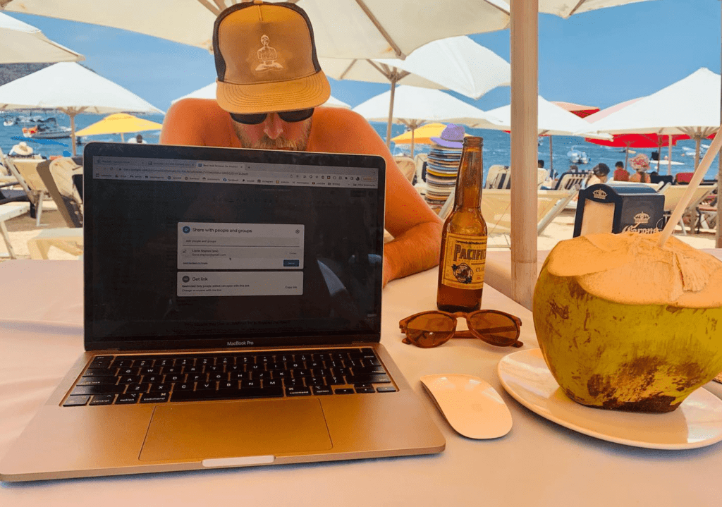 digital-nomad-working-on-laptop-at-mexico-beach