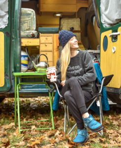 woman-living-in-van-sitting-outside