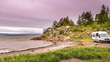 couple-in-van-parked-along-shoreline