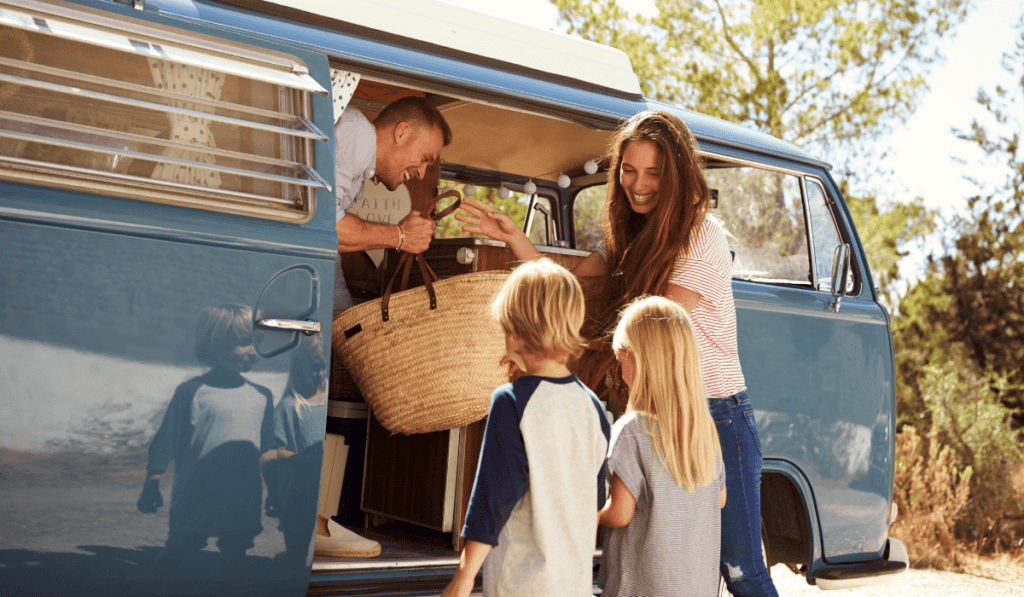 family-packing-up-camper-van