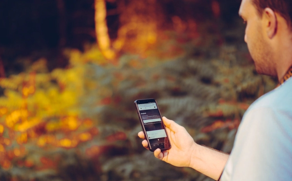 man-using-phone-app-outside