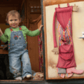vanlife-with-kids-toddler-standing-in-van-doorway