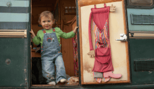 vanlife-with-kids-toddler-standing-in-van-doorway