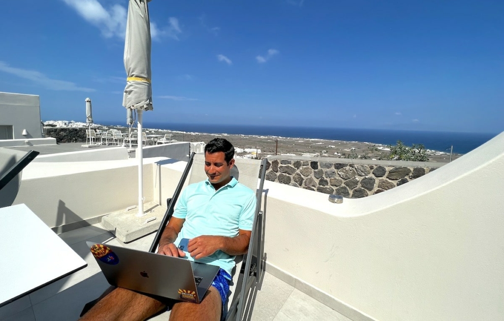working-on-laptop-hotel-balcony-min