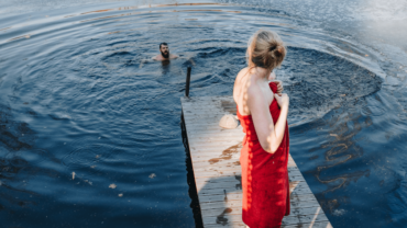 woman-drying-off-swim-in-lake-towel